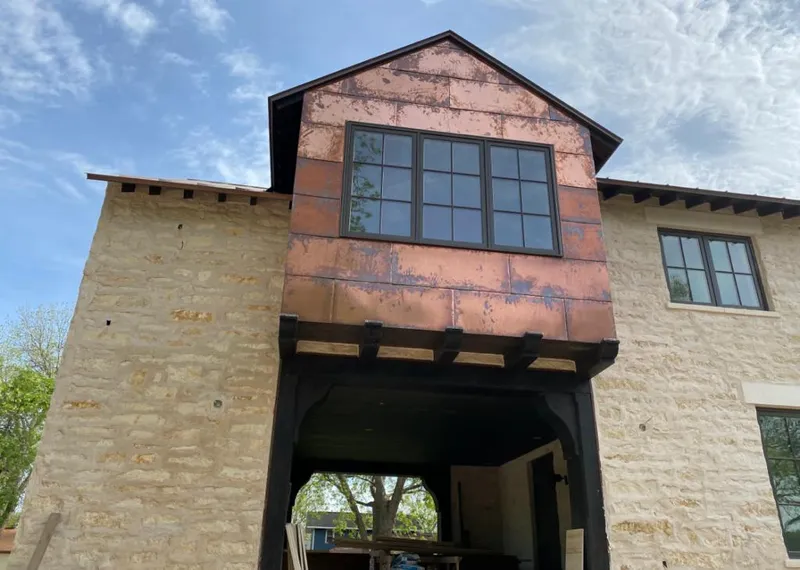 Copper metal panel facade on a stone building for Metal Roof Coating in Kennett Square