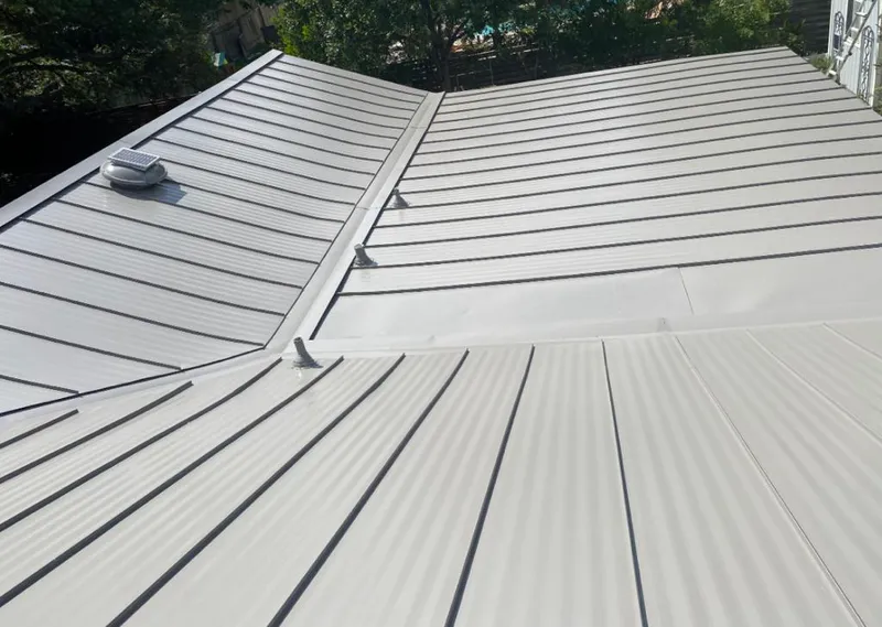 Solar attic fan installed on a metal roof for Roof Ventilation in Kennett Square